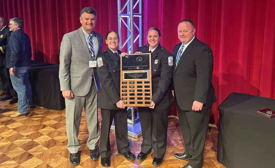 From left, Cape Fear Valley Health Vice President of Operations and Development Brian Pearce, Paramedics Hannah Thompson and Jessica Haines, and Corporate Director Patient Logistics and Mobile Integrated Health Brian Langston at the North Carolina Paramedic Competition State Championships held in Greensboro on May 4.