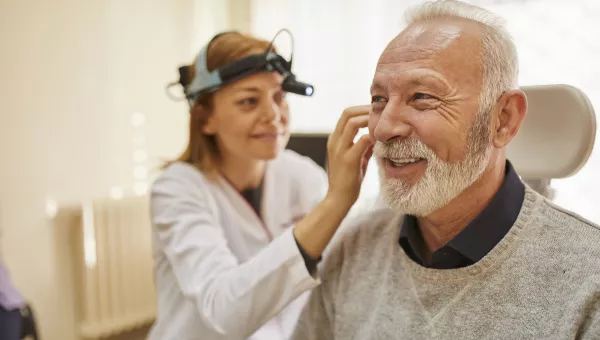 Otolaryngologist examining a patient