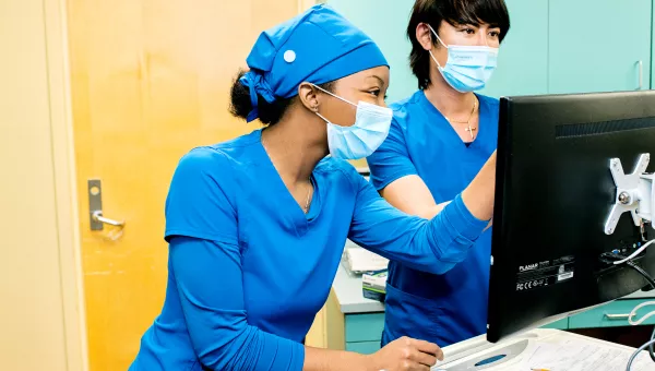 Two nursing students working together