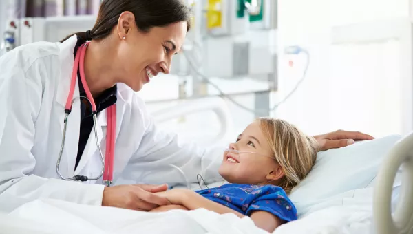 nurse smiling at child