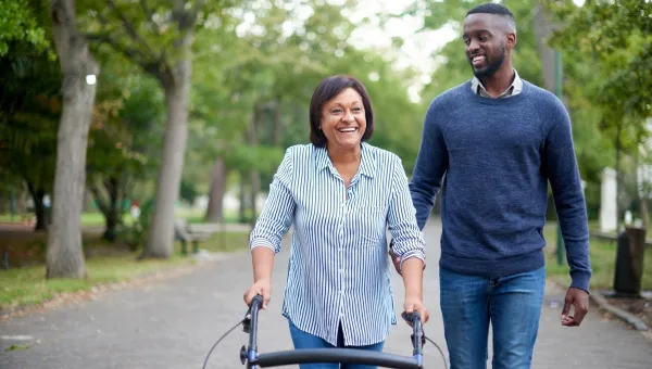 A man walking with a lady for recreational therapy