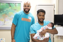 NFL player Julian Hill with baby Kaison Moody
